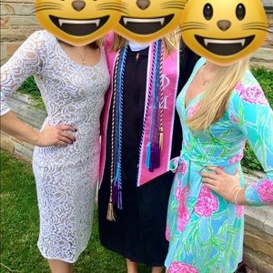 Lacy, figure-hugging white midi dress